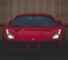 Voiture de sport rouge illustrant la competition automobile des 24 Heures du Mans 2026